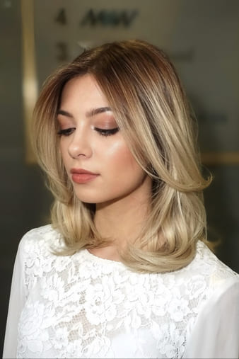 Blonde client with a soft, voluminous classic blow-dry.